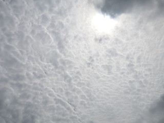 The Sun on Cloudy grey sky