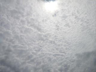 The Sun on Cloudy grey sky