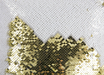 Gold and white shimmer sequin reversible fabric. Arts and crafts material idea concept. Whole background covered. © FotoHelin