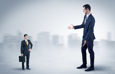 Giant businessman being afraid of small serious executor with suitcase
