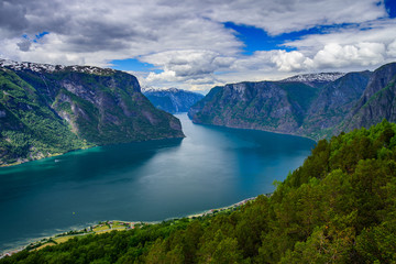 Fototapeta na wymiar Amazing nature view with fjord and mountains. Beautiful reflection. Location: Scandinavian Mountains, Norway. Artistic picture. Beauty world. The feeling of complete freedom