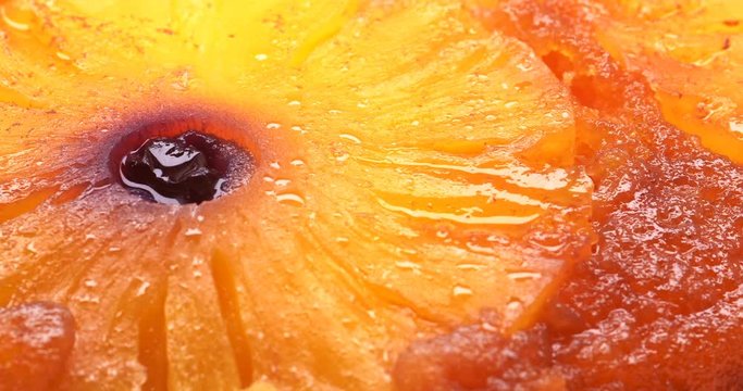 C4K closeup low angle shot of the baked pineapple pie on a turntable