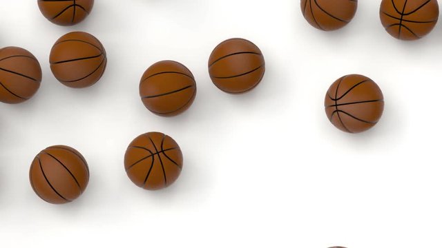 Animated close up of top view of many basketballs  falling onto white base or background bouncing and then tumbling or rolling toward the center.