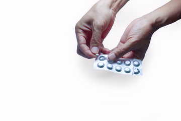 the adult hands holding opened aluminium foil medicine package on white background isolated