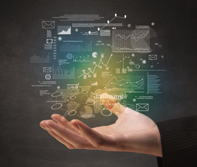 Demographic related charts, diagrams and graphs hovering over young hand