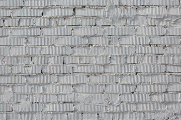 Abstract weathered texture stained old stucco light gray and aged paint white brick wall background in rural room, grungy rusty blocks of stonework technology color horizontal architecture wallpaper