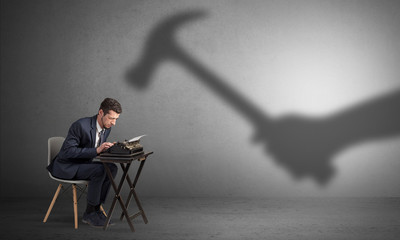 Shadow threatening hard worker man who is afraid
