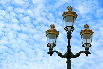 Fototapeta na wymiar Gorgeous vintage style street lamps of the Historical Centre of Cusco against cloudy blue sky, Cusco, Peru 