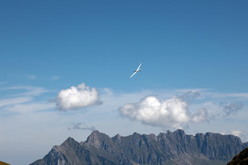 Fototapeta na wymiar Sailplane above Swiss Alps next to Walensee, Switzerland