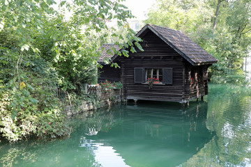 Fototapeta na wymiar Small house on the river