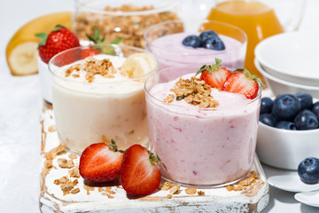 sweet yoghurts with fruits and berries for breakfast