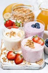 sweet yoghurts with fruits and berries for breakfast, vertical