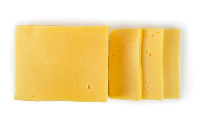 Cheese cut into slices on a white. Top view
