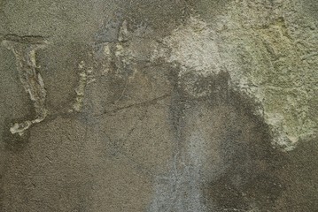 Gray stone texture from a dirty concrete wall with a crack