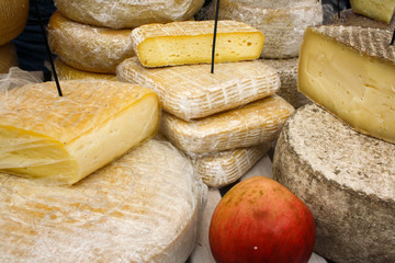 Old cheese is being stored as flat handmade pieces