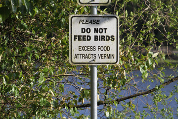 A sign asking you to not feed the birds