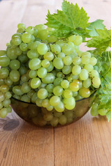 Bunches of green grapes in a Cup