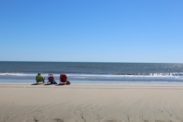 Three watching the waves
