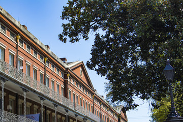 Looking up at the Red Brick Facade of the 1850 House by Jackson Square in the French Quarter of New Orleans, Louisiana, USA