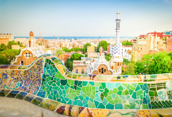 Fototapeta na wymiar Gaudi bench and cityscape of Barcelona from park Guell, famous view of Barcelona, Spain, toned