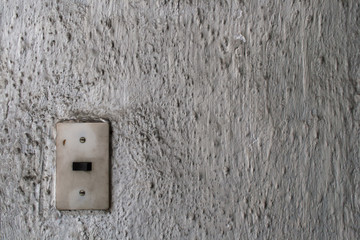 壁と照明のスイッチ