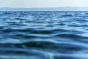 Texture of the blue sea with waves.