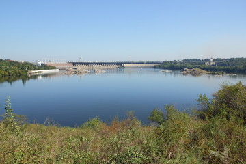 Fototapeta na wymiar DneproGES. Hydroelectric power station on Dnieper River in Ukraine. Creation of electricity on water