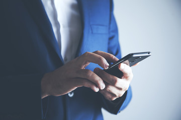 Hands of businessman calling by phone