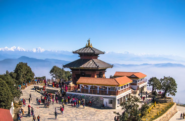 Naklejka premium Bhaleshwor Mahadev Temple with Himalaya range in the backdrop in Kathmandu, Nepal