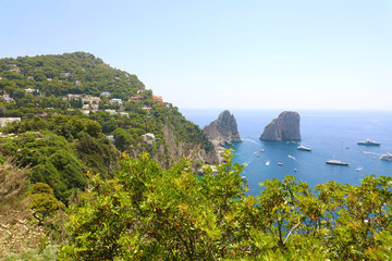 Stunning view of Capri island in a beautiful summer day with Faraglioni rocks Capri, Italy