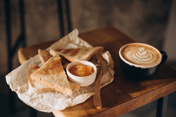 Cappuccino and toast with jam