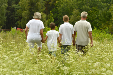 Older man and woman with their grandchildren