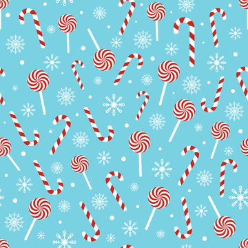 Christmas seamless pattern with candy canes, lollipops, snowflakes, snow ball on blue background. Design for wrapping paper, print, greeting cards. Winter Holiday concept. Vector illustration