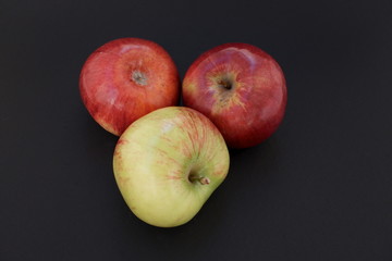 Fototapeta na wymiar red apples on black background