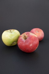 apples on black background