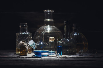 Various magic potions or colorful essential oils in the bottles on the table.