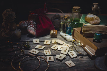 Fototapeta na wymiar Runes for divination on fortune teller desk table background. Futune reading concept.