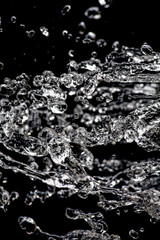 Water stream freezed in the air water drops levitation