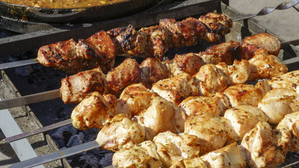 Meat on a skewer is grilled
