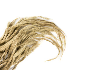 Light honey blonde real hand home made dreadlocks, also locs, dreads isolated on white background, room for text.