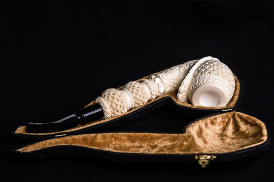 Hand Carved White Meerrschaum Pipe on Black Background