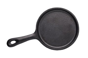 Empty cast-iron frying pan of black color isolated on white background, top view