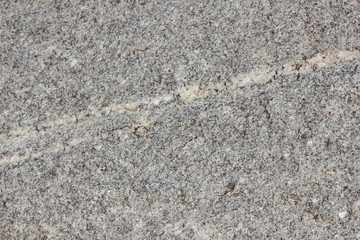 Granite background. Texture of gray granite stone. Natural pattern in gray tones. Abstract background