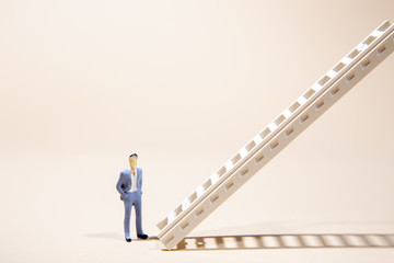 Businessman standing in front of stairs   pointing upwards. Success and development. Setting and achieving goals. Business idea. Increase in profits. the ladder to success.