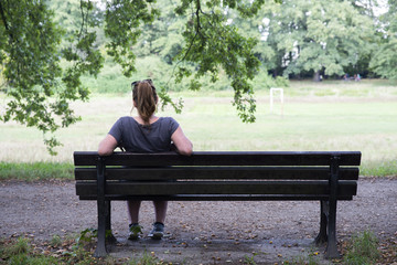 close up on lonely woman on the bench