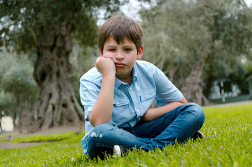 Fototapeta premium Toddler boy with funny face sad or bored