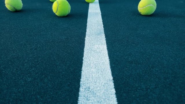 Camera tilt group of balls at tennis court 4k