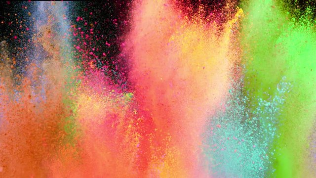 Super slowmotion shot of color powder explosions isolated on black background. Shot with high speed cinema camera at 1000fps