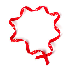 Wavy polka dot red ribbon isolated  on white background.