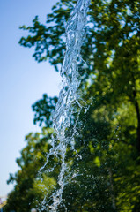 transparent falling water vertical flows, close up